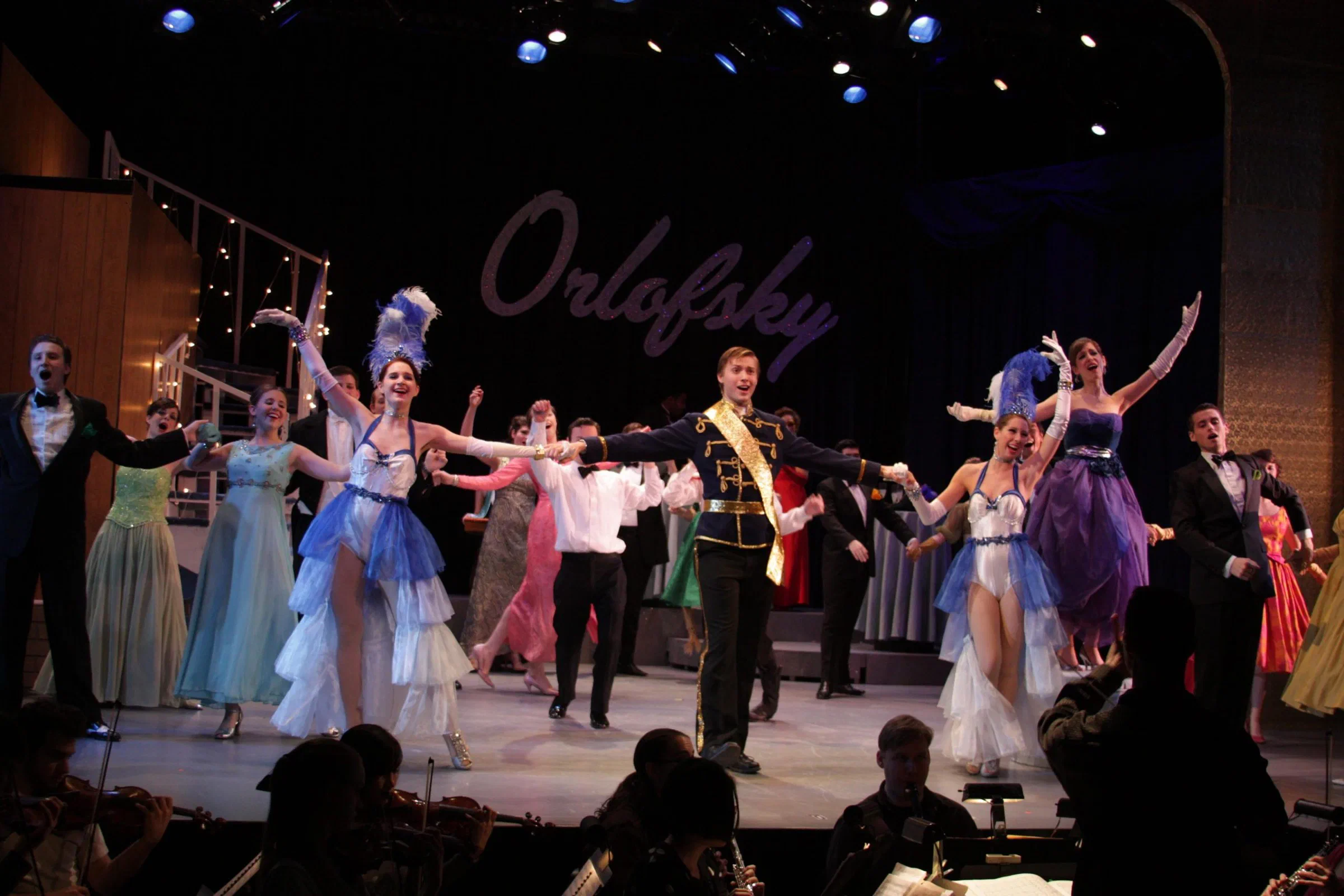 A large opera ensemble performs beneath the word Orlofsky.