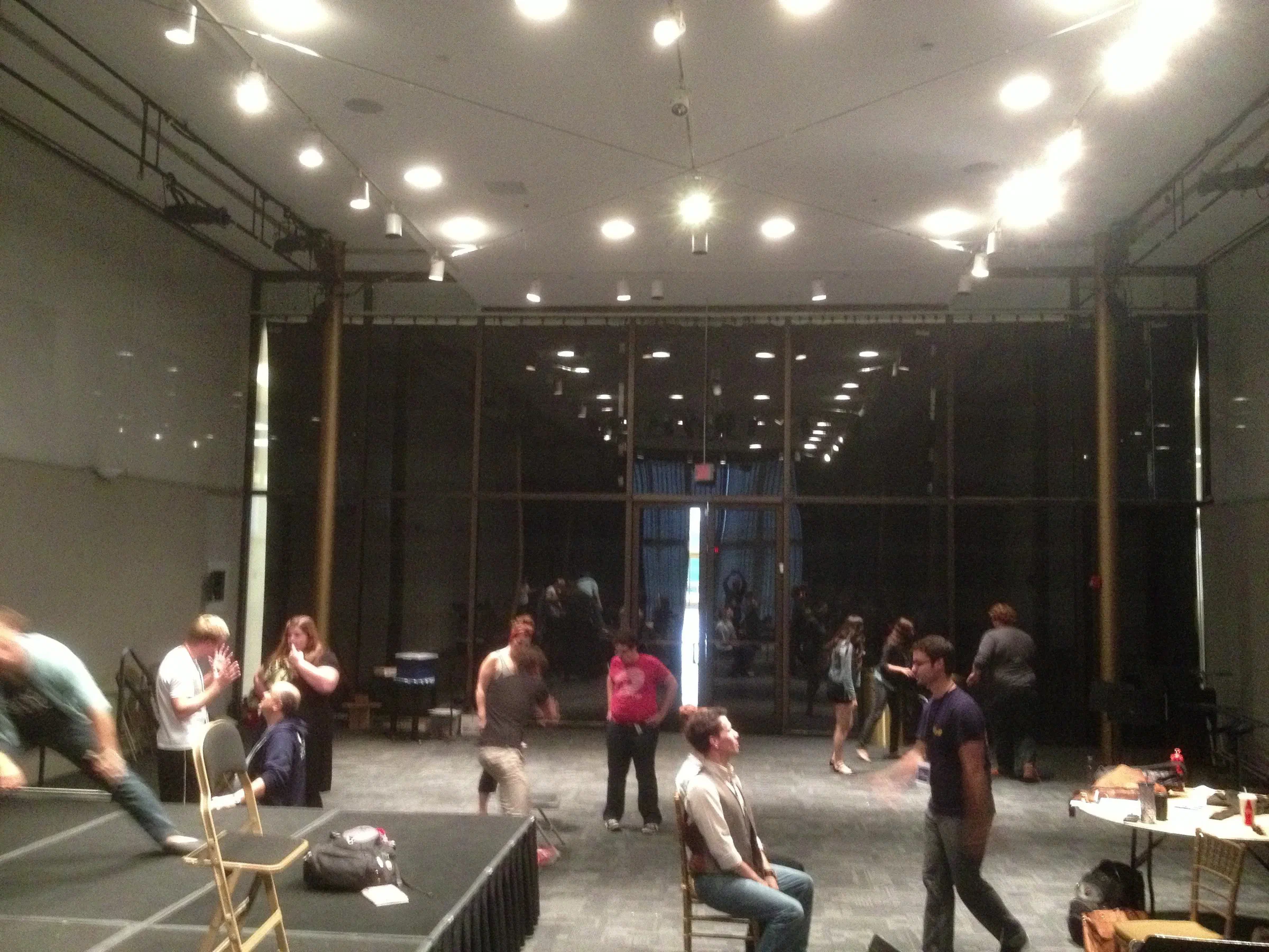 Directors and actors work in small groups across a rehearsal studio at the Kennedy Center.