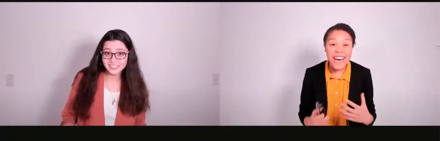 Two women gesture toward the camera from separate video windows.
